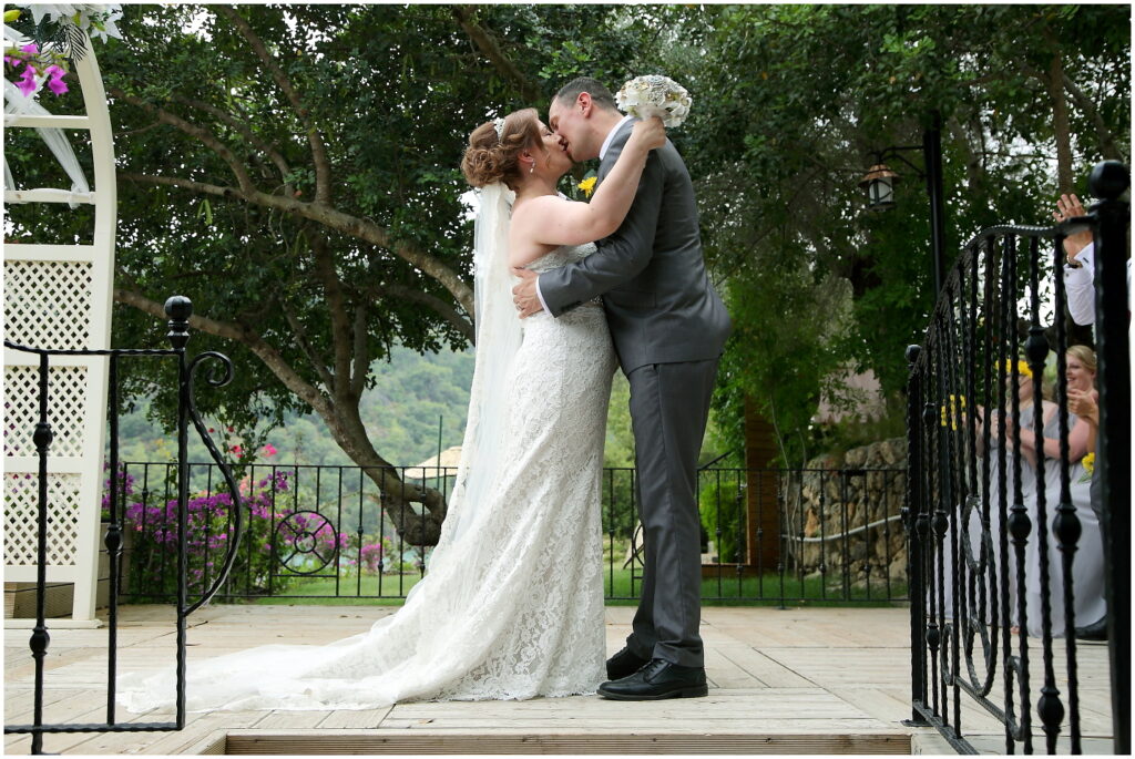 stunning scenery the bride and groom are kissing on wedding day