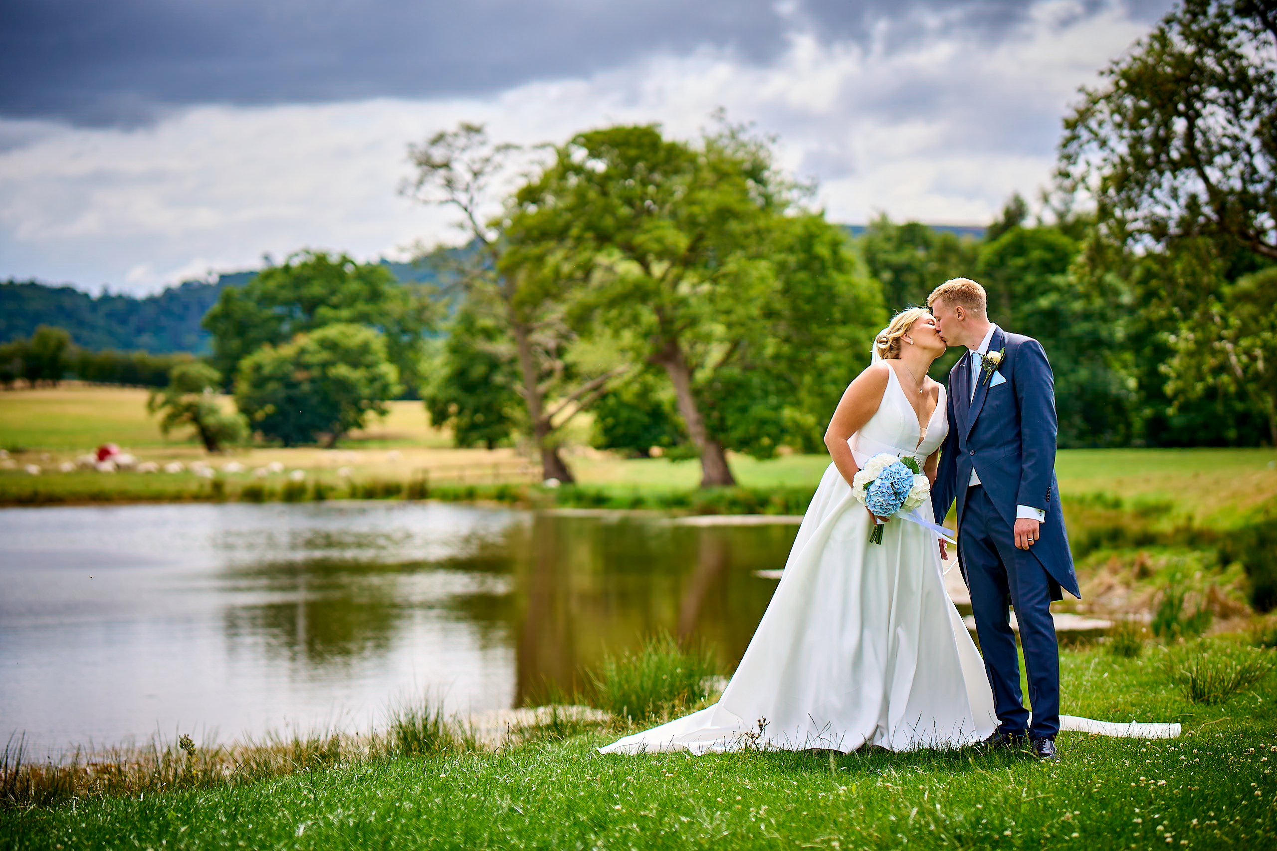 Authentin wedding photography showing a bride and groom kissing naturally at beautiful venues.