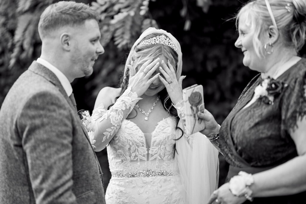 candid style photo of the bride on wedding day in black and white theme