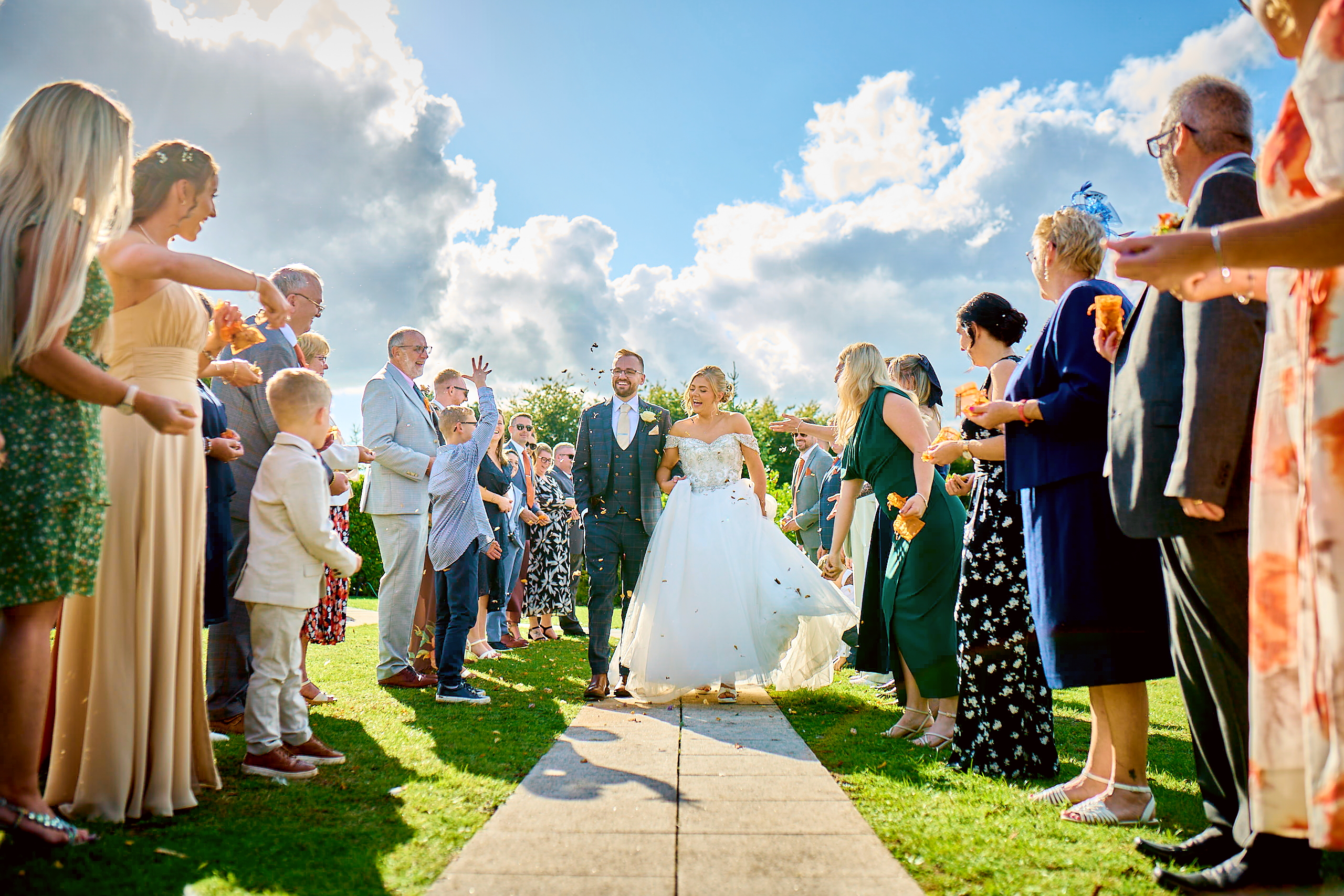 Documentary style wedding photography showing the bride and groom holding hands naturally.